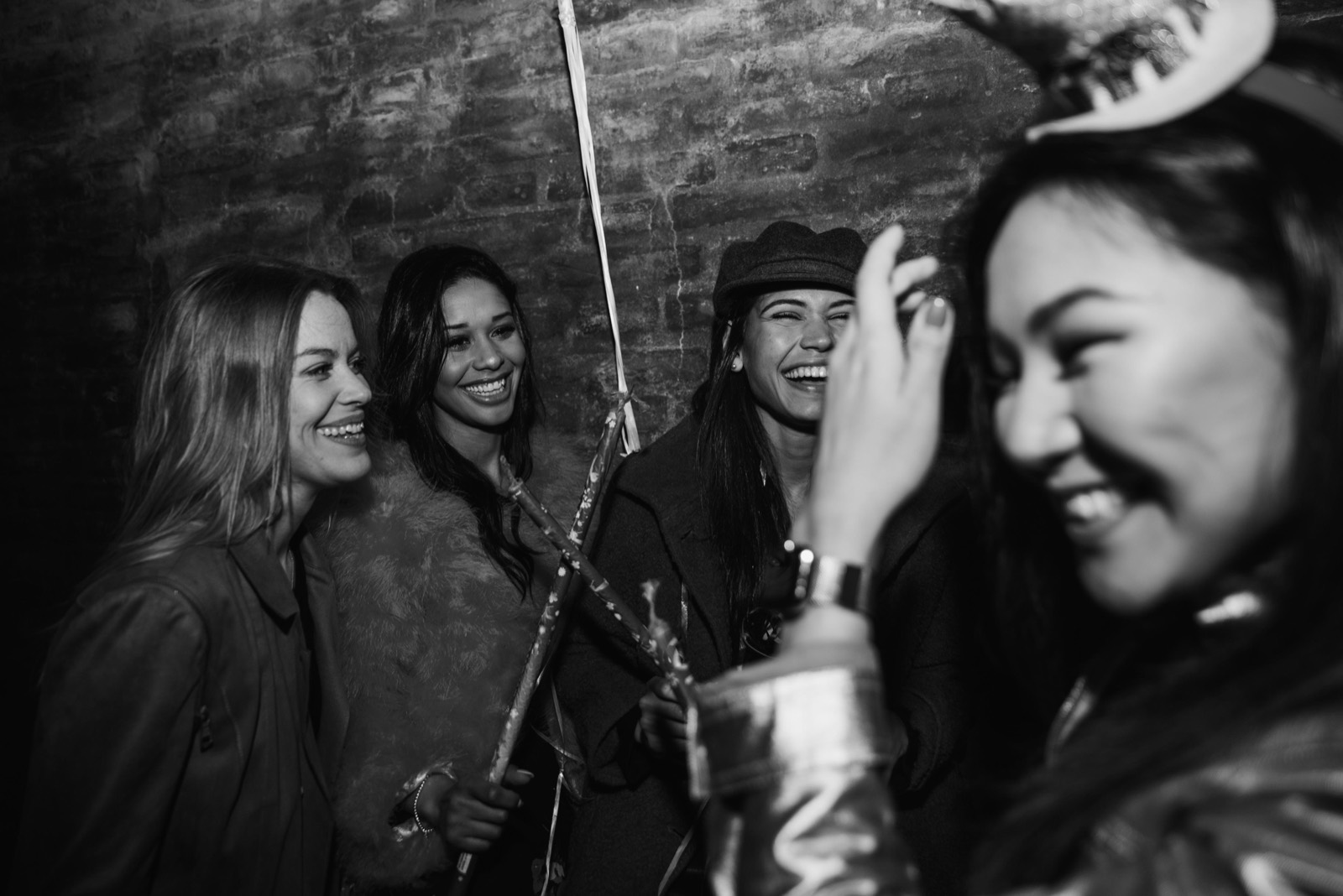 Friends laughing together on a night out.
